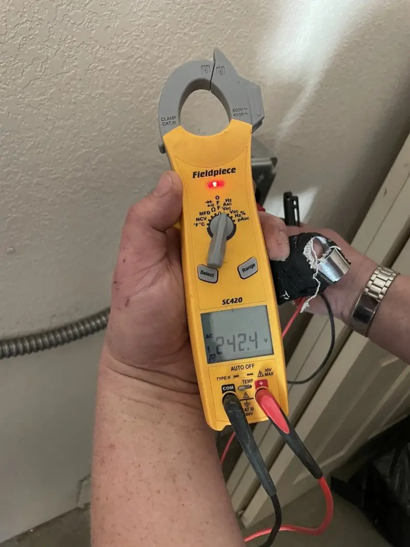 Voltage testing with clamp meter during Generator Installation in Oxnard